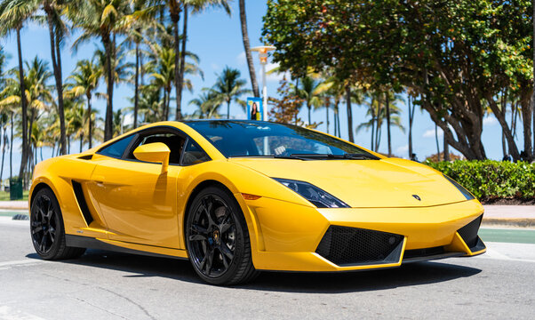 Miami, Florida, USA - April 13, 2025: Luxury sportscar Lamborghini Gallardo. Car Lamborghini Gallardo outdoor. Yellow orange car, top corner view. Lamborghini Gallardo sportscar