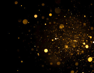 Shimmering gold dust particles and sparkling bokeh lights on a dark background. Abstract festive overlay.