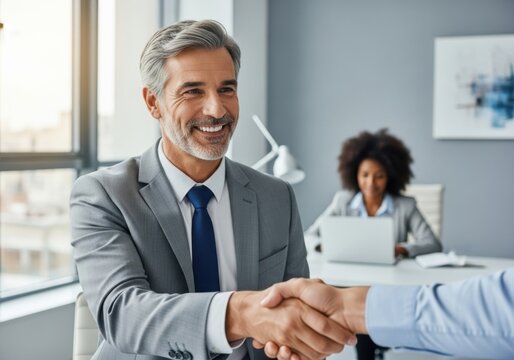 Successful business handshake between two professionals in an office setting
