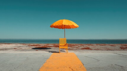 Empty yellow beach chair & umbrella, calm water