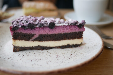 Delicious layered cake with berries on a plate