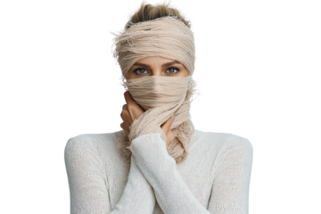 A woman partially wrapped in fabric, conveying emotion and mystery. Perfect for themes of identity, concealment, and introspection.