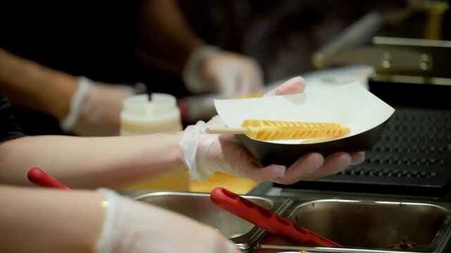 Pouring Batter on Hot Waffle Iron on event. Professional Waffle Machine in Action