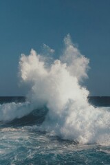 High-Quality Powerful Ocean Wave Crashing Sea Spray on Clear Blue Sky Premium Nature for Modern Marketing and Environmental Content