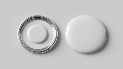 Two blank white round button lids, one open