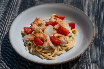 Pasta with shrimp and tomatoes. 