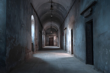 An old corridor of a creepy prison abandoned a long time ago.