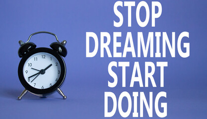 Stop Dreaming Start Doing symbol. Beautiful purple background with alarm clock. Business and Stop...