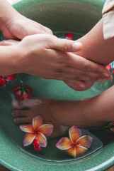 Vertical Horizon Massage Thai Spa foot massage oil therapy. Close up woman foot therapy relax treatment Aromatherapy salon. Vertical Spa legs relaxation muscle relief. Woman relax Foots spa wellness