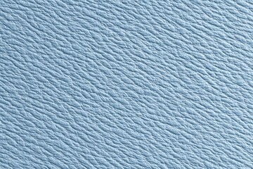 Light blue textured surface with detailed wrinkles close-up