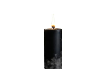 Black candle burns with flickering flame while wisps of smoke gracefully rise into the air, creating a captivating atmosphere in low light