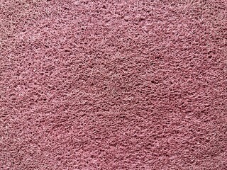 Red rubber foot mat texture. Patterned doormat rug background. Rubber doormat.