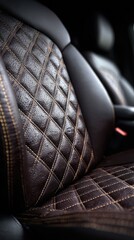 Close-up of dark brown leather car seat with diamond quilting