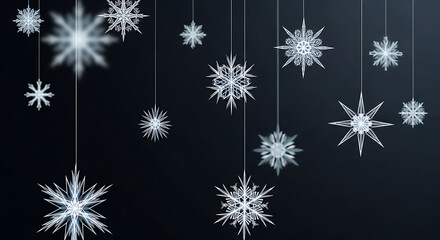 A collection of delicate, glowing snowflakes suspended against a dark, gradient background, creating a magical winter atmosphere.
