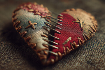 Broken heart being stitched together