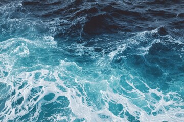 Swirling aqua and teal ocean waves creating a mesmerizing abstract pattern under bright sunlight