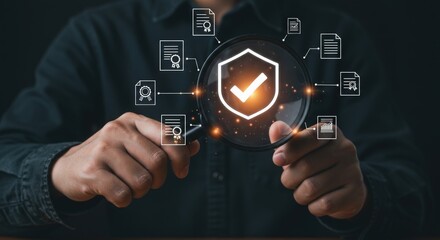 Person holding magnifier over shield with checkmark for security and compliance