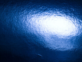 Shiny Blue Metallic Textured Surface with Light Reflection