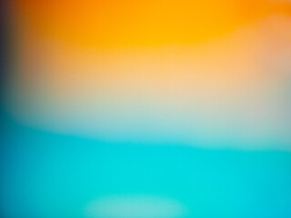 Abstract blurred background with orange and blue gradient colors