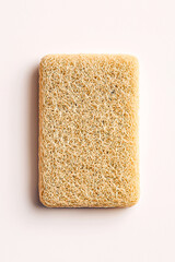 Realistic loofah kitchen sponge mockup with natural fiber texture on white background