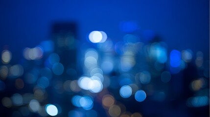 Fototapeta premium Abstract city light bokeh in deep blue tones, evoking the atmospheric glow of an urban nightscape. 