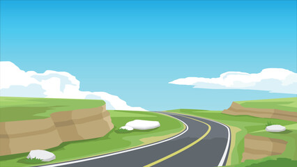 Winding asphalt road surrounded by cliffs and hills, the path is filled with green fields, leading to a clear blue sky with fluffy white clouds.