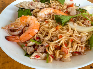 Thai spicy salad with mama noodles, Vietnamese sausage, minced pork and shrimps