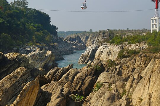 The Bhedaghat ropeway in Jabalpur provides a panoramic view of the Marble Rocks and Dhuandhar Falls in Madhya Pradesh, India.