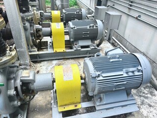 Close-up of electric motors and mechanical components within an industrial machine. The sturdy...