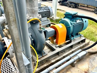 Close-up of electric motors and mechanical components within an industrial machine. The sturdy...