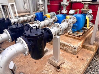 Industrial pump system with pipeline connections, strainers, and electric motors. Used for fluid...