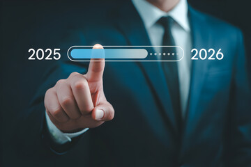 Businessman advances progress bar from 2025 towards 2026 with futuristic interface