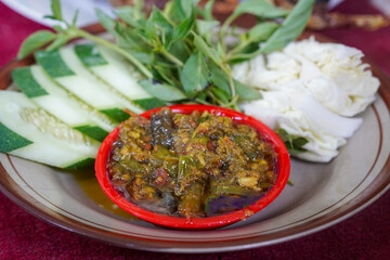 Fried Duck with Green Chili Sambal, captured on August 12, 2025. Crispy fried duck served with spicy green chili sambal, fresh vegetables, and steamed rice on a traditional plate.