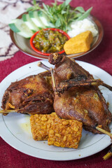 Fried Duck with Green Chili Sambal, captured on August 12, 2025. Crispy fried duck served with spicy green chili sambal, fresh vegetables, and steamed rice on a traditional plate.