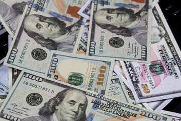 Pile of US Dollar Bills. American currency bills piled up loosely, representing cash flow, finance, and economic themes.