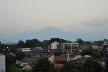 architectural view of buildings in the highlands with mountains in the background