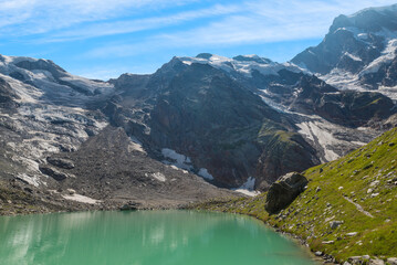Macugnaga at the Alpe Pedriola, Italy. European Alps with a glacier lake at the foot of the Punta...