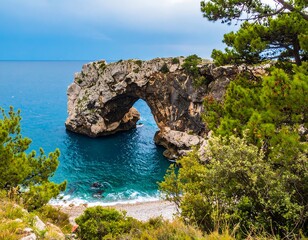 Coastal archway over tranquil bay
