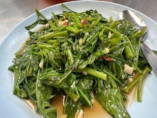 Stir fried morning glory with garlic and chili, Thai food
