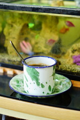 Freshly Brewed Coffee in a Traditional Cup. A close-up shot of freshly brewed coffee in a traditional cup on a woven table mat, perfect for coffee enthusiasts and product photography.