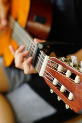 close-up shots of hands playing the guitar, showcasing different finger positions and techniques, perfect for music enthusiasts and instructional content
