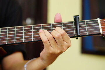 close-up shots of hands playing the guitar, showcasing different finger positions and techniques, perfect for music enthusiasts and instructional content