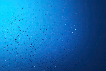 Fototapeta premium Abstract, vibrant, blue background with scattered, tiny, square confetti