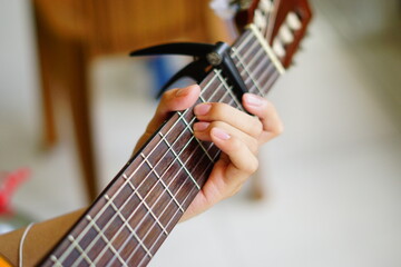 close-up shots of hands playing the guitar, showcasing different finger positions and techniques,...