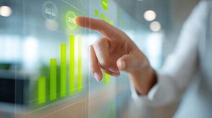 Person Interacting with Green Energy Data Visualization on Transparent Screen, Showing Sustainability Metrics