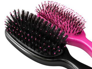 Two oval-shaped hairbrushes, one black and one pink, close-up view of bristles