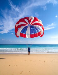 Parasailor preparing for launch on a sunny beach with turquoise water and blue sky