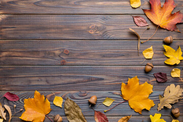 Autumn composition. Pattern made of dried leaves and other design accessories on table. Flat lay, top view