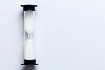 hourglass on the table, sand clock as time passing concept for business deadline, copy space
