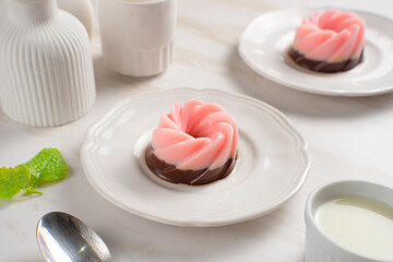 Strawberry and chocolate Pudding with sauce on white plate. Perfect for recipes, articles or any cooking content
